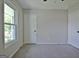 This bedroom features a bright window, neutral walls, and plush carpeting for a cozy feel at 110 Chesterfield Ct, Fayetteville, GA 30214