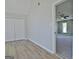 Bedroom with gray walls, vinyl floors, closet, and view into another room at 110 Chesterfield Ct, Fayetteville, GA 30214