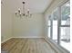 Dining room with chandelier and large window for natural light at 110 Chesterfield Ct, Fayetteville, GA 30214
