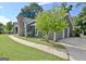 Features a well-maintained lawn, driveway, and a two-car garage on a charming home at 110 Chesterfield Ct, Fayetteville, GA 30214