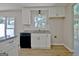Kitchen featuring granite countertops, modern appliances, white cabinets, and a view to the outside at 110 Chesterfield Ct, Fayetteville, GA 30214