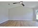 Bright living room with vaulted ceilings, ceiling fan, and wood-look flooring at 110 Chesterfield Ct, Fayetteville, GA 30214