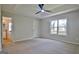 Spacious main bedroom with tray ceiling, plush carpet and ensuite bathroom at 110 Chesterfield Ct, Fayetteville, GA 30214