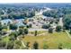 Aerial view showcasing community amenities, sports courts and the lake at 2230 Cambridge Hill Ct, Dacula, GA 30019