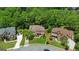 Aerial view of homes with manicured lawns on a tree-lined street at 2230 Cambridge Hill Ct, Dacula, GA 30019