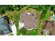 Expansive aerial view of a home with a backyard deck, playground, and swimming pool, surrounded by lush greenery at 2230 Cambridge Hill Ct, Dacula, GA 30019