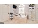 Bathroom with bathtub, tile surround, built-in storage and decorative window at 2230 Cambridge Hill Ct, Dacula, GA 30019