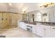 Bathroom with dual sinks, walk-in shower, granite counters, and built-in shelving at 2230 Cambridge Hill Ct, Dacula, GA 30019
