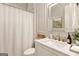 Elegant bathroom featuring marble countertop, gold faucet, and a modern, well-lit mirror at 2230 Cambridge Hill Ct, Dacula, GA 30019
