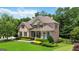 Beautiful two-story brick home with stone accents and manicured landscaping at 2230 Cambridge Hill Ct, Dacula, GA 30019