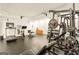 Well-equipped home gym with treadmill, weight machines, and ample space for a full workout at 2230 Cambridge Hill Ct, Dacula, GA 30019
