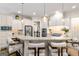 Well-equipped kitchen features a granite countertop island and stainless steel appliances at 2230 Cambridge Hill Ct, Dacula, GA 30019