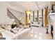 Stately living room with fireplace, coffered ceilings, and lots of natural light at 2230 Cambridge Hill Ct, Dacula, GA 30019