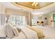 Spacious bedroom with sitting area, trey ceilings, neutral tones and large windows at 2230 Cambridge Hill Ct, Dacula, GA 30019