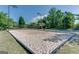 Volleyball court featuring bright sand and surrounding green grass at 2230 Cambridge Hill Ct, Dacula, GA 30019
