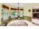 Bright breakfast nook with bay windows, a round rug, and half wall trim at 180 Moseley Crossing Dr, Stockbridge, GA 30281