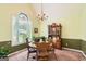 Bright dining room with elegant chandelier and large window at 180 Moseley Crossing Dr, Stockbridge, GA 30281