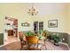Bright dining area featuring a chandelier and a view into the adjacent kitchen at 180 Moseley Crossing Dr, Stockbridge, GA 30281