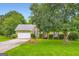 Charming single Gathering home with a well-manicured front yard and brick facade at 180 Moseley Crossing Dr, Stockbridge, GA 30281