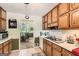 Functional kitchen with white appliances and a seamless view into the dining area at 180 Moseley Crossing Dr, Stockbridge, GA 30281