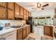 Functional kitchen with stainless steel appliances and a seamless view into the breakfast nook at 180 Moseley Crossing Dr, Stockbridge, GA 30281