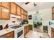 Functional kitchen showcasing white appliances and seamless flow into the dining area at 180 Moseley Crossing Dr, Stockbridge, GA 30281