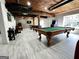 Spacious finished basement features a pool table, piano, and arcade games, perfect for entertaining at 7093 Vaughn Rd, Canton, GA 30115