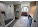 Bathroom featuring a glass-enclosed shower, double vanity, and stylish tile flooring and a scenic window view at 7093 Vaughn Rd, Canton, GA 30115