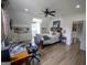 Bedroom boasts a ceiling fan, built-in shelving, work space and natural light at 7093 Vaughn Rd, Canton, GA 30115