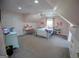 Charming bedroom with a comfortable bed, a ceiling fan, carpet flooring, and a cozy, feminine decor at 7093 Vaughn Rd, Canton, GA 30115