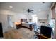 Cozy bedroom features a ceiling fan, study space, gaming chair, and window for light at 7093 Vaughn Rd, Canton, GA 30115