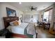 Spacious bedroom with hardwood floors, ceiling fan, a large bed, and an adjacent office space at 7093 Vaughn Rd, Canton, GA 30115