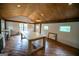 Bright dining room with wood floors, a long table, and ample natural light from the many windows at 7093 Vaughn Rd, Canton, GA 30115