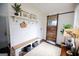 Welcoming mudroom with a bench, storage, and a unique sliding barn door for a rustic touch at 7093 Vaughn Rd, Canton, GA 30115