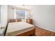 Comfortable bedroom with natural light, hardwood floors, and a simple, inviting design at 1055 Avalon Dr, Lawrenceville, GA 30044