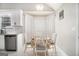 Bright dining area features a bay window, seating for four, and modern lighting at 1055 Avalon Dr, Lawrenceville, GA 30044