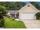Charming single-Gathering home with a two-car garage and manicured front lawn at 1055 Avalon Dr, Lawrenceville, GA 30044