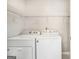 Functional laundry room with modern washer and dryer, providing convenience and efficiency at 1055 Avalon Dr, Lawrenceville, GA 30044