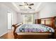 Large main bedroom featuring hardwood floors, tray ceiling, and a bright window for natural light at 1055 Avalon Dr, Lawrenceville, GA 30044