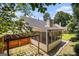 Enclosed sunroom with wooden structure, screened windows, and a nice view of the backyard at 1055 Avalon Dr, Lawrenceville, GA 30044