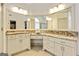 This bathroom features granite countertops, double sinks, and updated cabinets at 121 Fairway Overlook, Woodstock, GA 30188