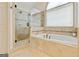 This bathroom features a separate shower and tub at 121 Fairway Overlook, Woodstock, GA 30188