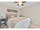 This neutral bedroom includes bedside tables and decor at 121 Fairway Overlook, Woodstock, GA 30188