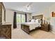 This bedroom includes a rustic-style dresser and bedside tables at 121 Fairway Overlook, Woodstock, GA 30188