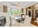 Dining room with wainscoting, neutral decor, and a chandelier at 121 Fairway Overlook, Woodstock, GA 30188