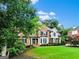 Beautiful brick two-story home with manicured lawn and charming curb appeal at 121 Fairway Overlook, Woodstock, GA 30188