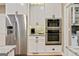 Kitchen features stainless steel appliances and granite countertops at 121 Fairway Overlook, Woodstock, GA 30188