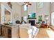 Elegant living room with soaring ceilings, fireplace, large windows, and hardwood floors at 121 Fairway Overlook, Woodstock, GA 30188
