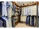 This walk-in closet includes custom shelving and closet rod at 121 Fairway Overlook, Woodstock, GA 30188