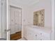 Bright bathroom with white cabinetry, a decorative mirror, and modern fixtures for a clean aesthetic at 2917 Rockingham Nw Dr, Atlanta, GA 30327